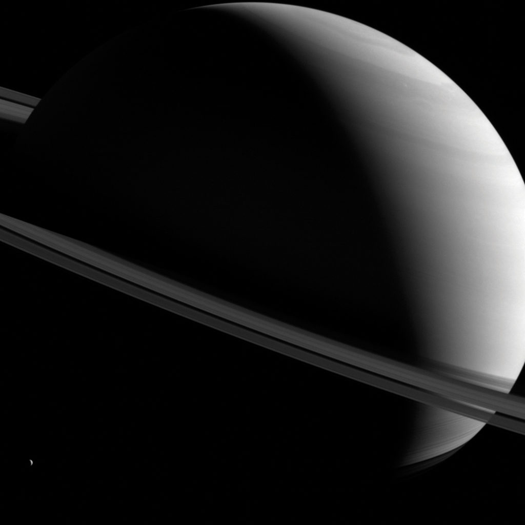 A deep space photo of Saturn and its rings