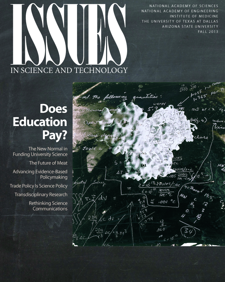 Magazine cover shows equations on an educational blackboard