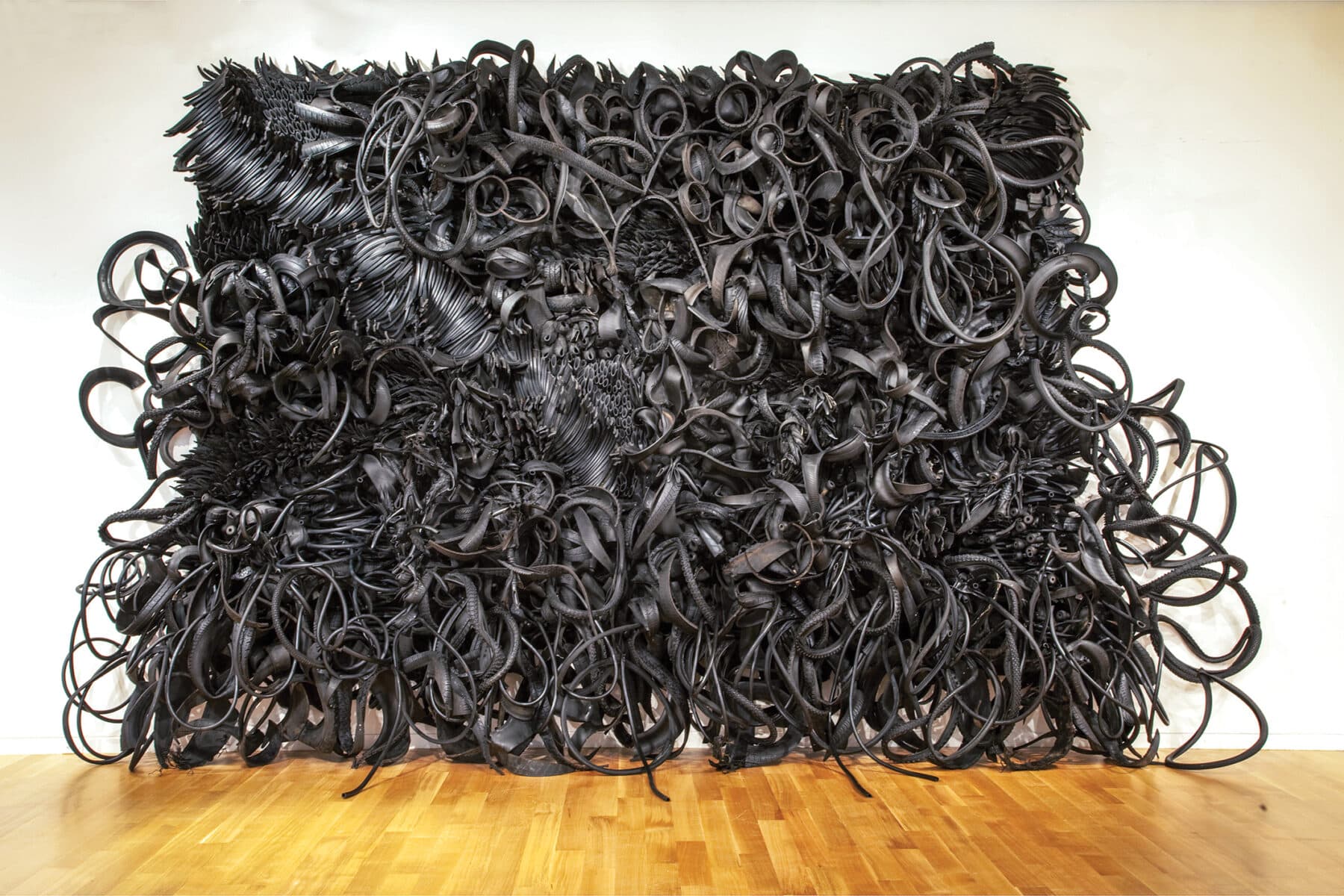 Chakaia Booker, It’s So Hard to Be Green, 2000, rubber tires and wood, overall: 150 x 252 x 24 inches. Copyright of the artist and courtesy of David Nolan Gallery. Image credit: Peter Vanderwarker.
