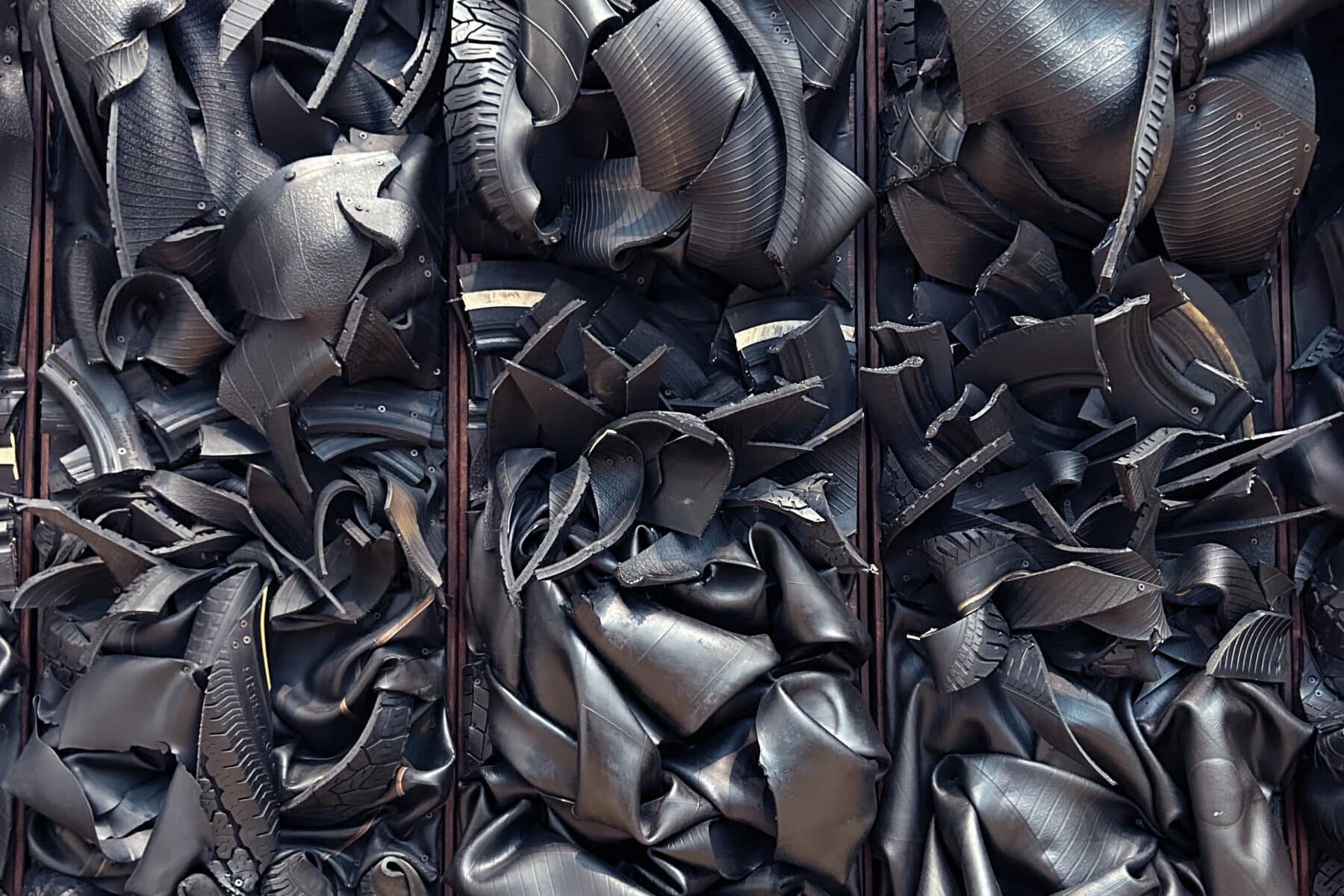 Chakaia Booker, Echoes in Black (Industrial Cicatrization) (detail), 1996, rubber tires and wood, 14 vertical modules, overall: 97 x 269 x 6 inches. Copyright of the artist and courtesy of David Nolan Gallery. Photo by Alana Quinn.