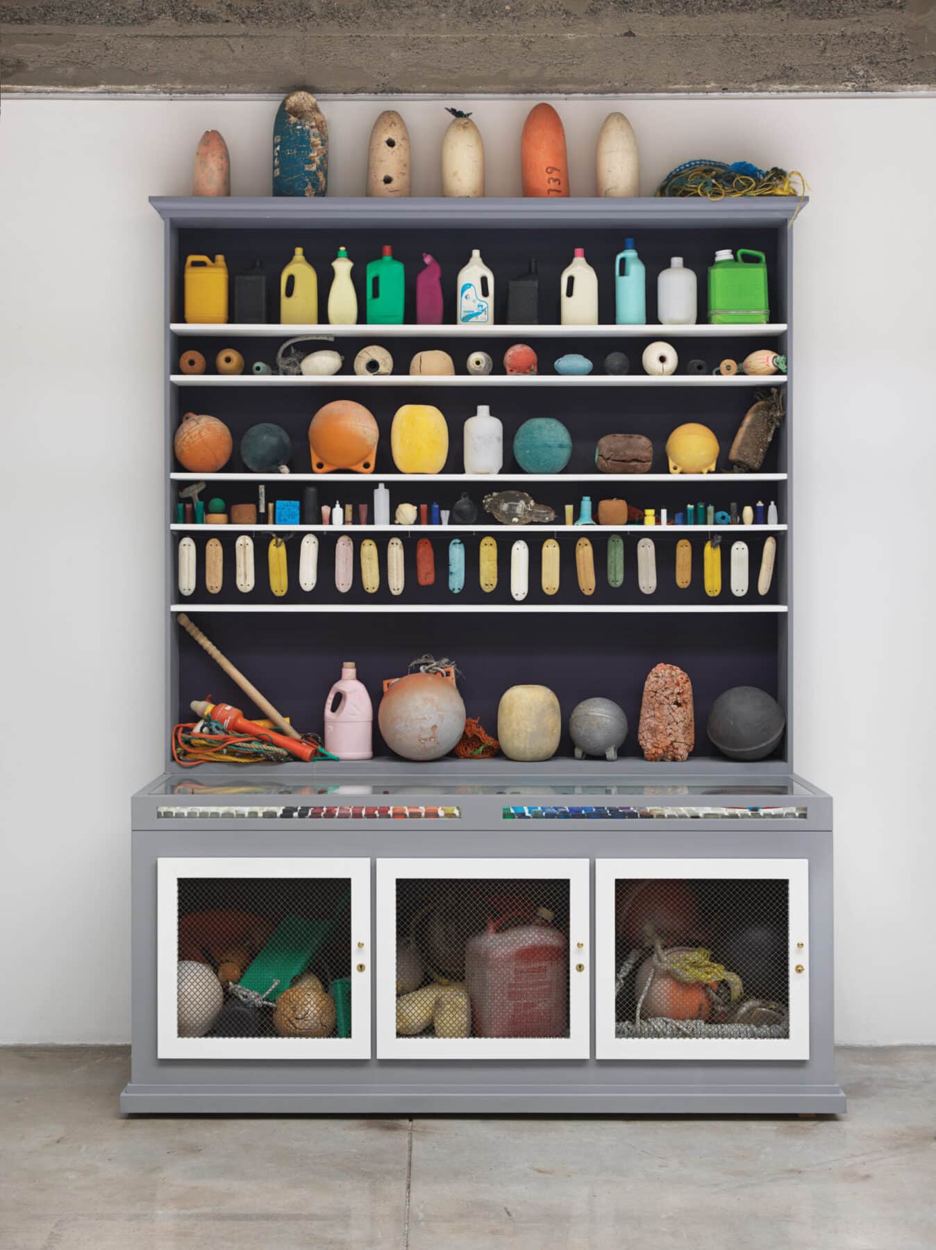 Mark Dion, “Cabinet of Marine Debris,” 2014, wood and metal cabinet, marine debris, plastic, rope, 
113 x 84 x 32 inches. Margulies Collection, Miami. Courtesy American Federation of Arts.