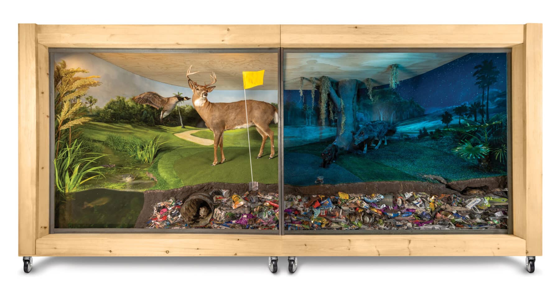 Mark Dion and Alexis Rockman (with Aaron Delehanty, Loud Cow Studio), “American Landscape,” 2022, mixed-media diorama with taxidermy, found objects, and painted background, 96 in. x 16 ft. x 87 in. Courtesy the artists and American Federation of Arts.