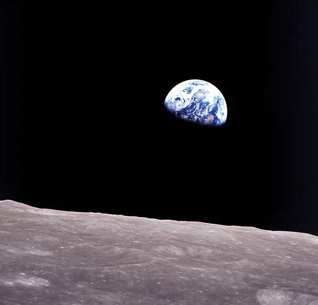 Taken aboard Apollo 8 by Bill Anders, this iconic picture shows Earth peeking out from beyond the lunar surface as the spacecraft orbited the Moon, with astronauts Anders, Frank Borman, and Jim Lovell aboard. Image credit: NASA.
